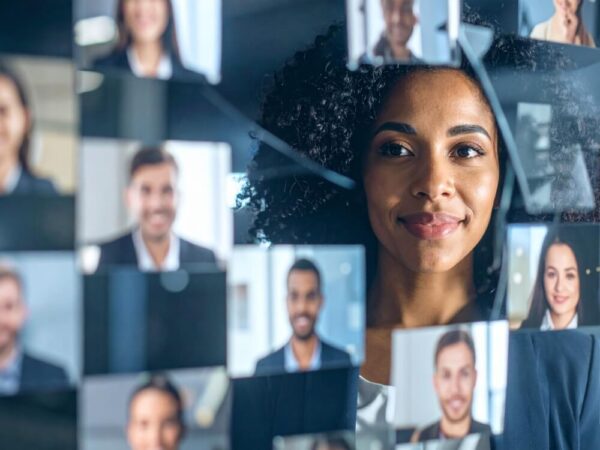 Woman viewing a video call grid
