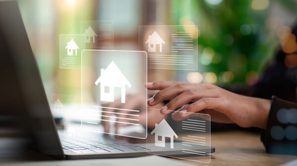 person typing laptop online rental property listings